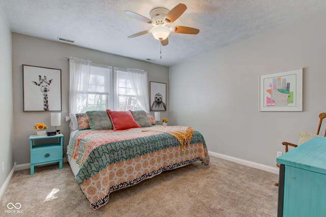3533 Alexandria Pike, Anderson, IN 46012 - carpeted bedroom with baseboards, ceiling fan, and a textured ceiling