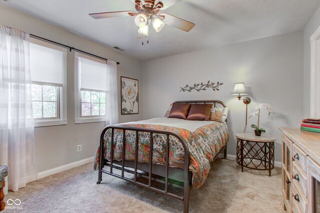 3533 Alexandria Pike, Anderson, IN 46012 - bedroom featuring light colored carpet, baseboards, and a ceiling fan