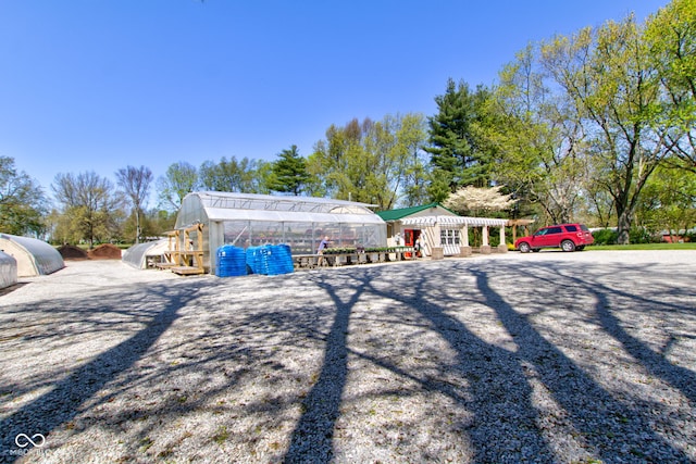 3533 Alexandria Pike, Anderson, IN 46012 - rear view of property with a greenhouse and an outdoor structure