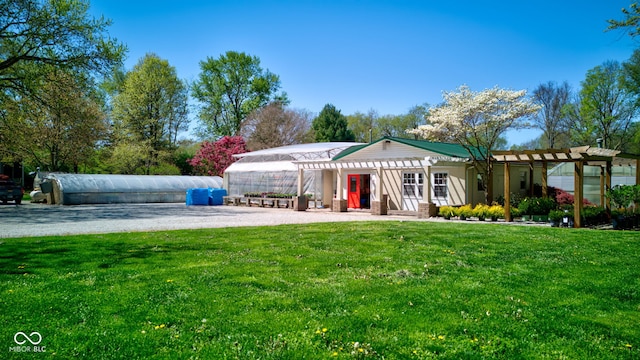 3533 Alexandria Pike, Anderson, IN 46012 - rear view of property with a pergola and a lawn