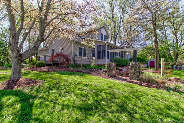 3533 Alexandria Pike, Anderson, IN 46012 - view of property exterior with a sunroom and a lawn