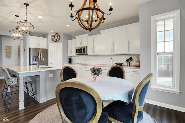 1071 Serenity Ct, Carmel, IN 46280 - dining area with a chandelier, baseboards, recessed lighting, and dark wood finished floors