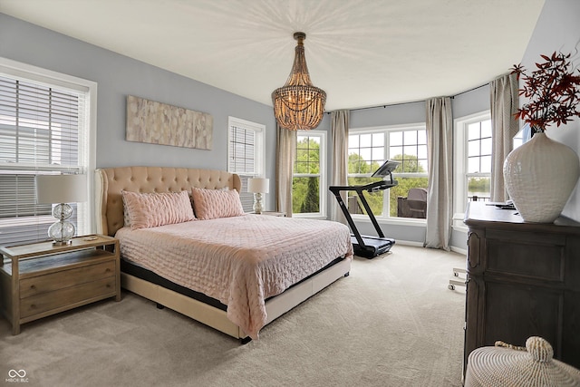 1071 Serenity Ct, Carmel, IN 46280 - bedroom with light carpet and a chandelier