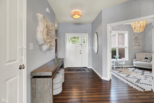 1071 Serenity Ct, Carmel, IN 46280 - foyer with dark wood-style floors, baseboards, and a chandelier