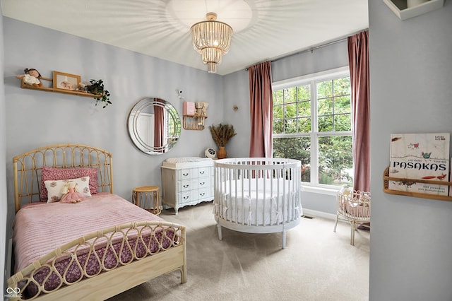 1071 Serenity Ct, Carmel, IN 46280 - carpeted bedroom with a chandelier and baseboards