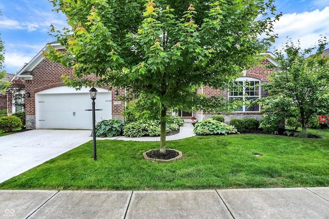 1071 Serenity Ct, Carmel, IN 46280 - view of property hidden behind natural elements with brick siding, a front lawn, driveway, and an attached garage