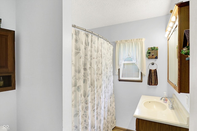 4125 S Post Rd, Indianapolis, IN 46239 - bathroom featuring vanity, a textured ceiling, and a shower with curtain