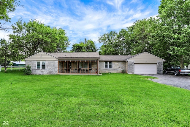 4125 S Post Rd, Indianapolis, IN 46239 - ranch-style home featuring stone siding, a garage, driveway, and a front lawn