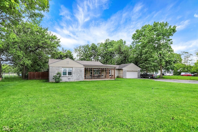 4125 S Post Rd, Indianapolis, IN 46239 - ranch-style house featuring a garage, asphalt driveway, and a sunroom