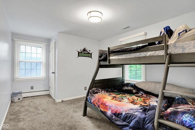 8301 E County Road 801 S, Plainfield, IN 46168 - carpeted bedroom featuring multiple windows, baseboard heating, and baseboards
