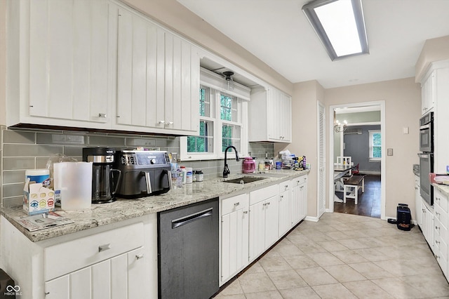 8301 E County Road 801 S, Plainfield, IN 46168 - kitchen featuring a sink, appliances with stainless steel finishes, decorative backsplash, white cabinets, and healthy amount of natural light