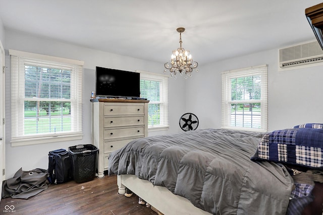 8301 E County Road 801 S, Plainfield, IN 46168 - bedroom featuring multiple windows, dark wood-type flooring, a chandelier, and a wall mounted AC