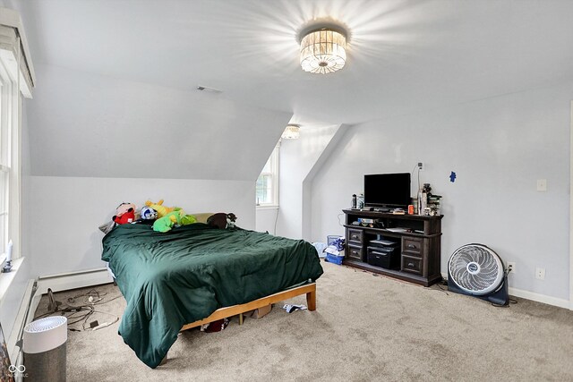 8301 E County Road 801 S, Plainfield, IN 46168 - carpeted bedroom featuring lofted ceiling, baseboards, and a baseboard radiator