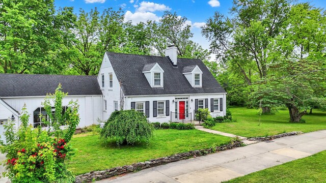 8301 E County Road 801 S, Plainfield, IN 46168 - new england style home with a front yard, a chimney, and roof with shingles
