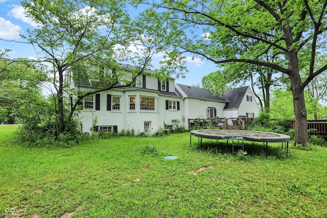 8301 E County Road 801 S, Plainfield, IN 46168 - rear view of house featuring a trampoline and stucco siding
