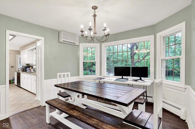 8301 E County Road 801 S, Plainfield, IN 46168 - dining area with a wall mounted AC, wainscoting, a chandelier, wood finished floors, and a decorative wall