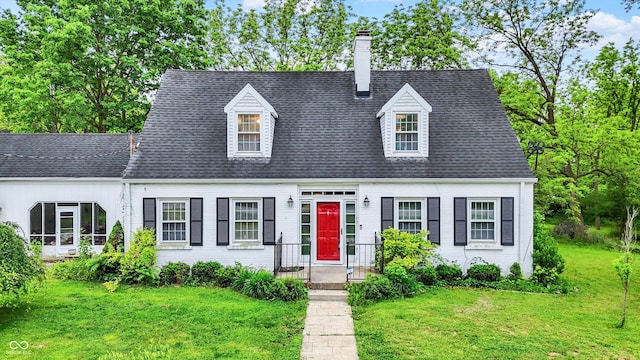 8301 E County Road 801 S, Plainfield, IN 46168 - new england style home featuring a chimney, a front lawn, and a shingled roof