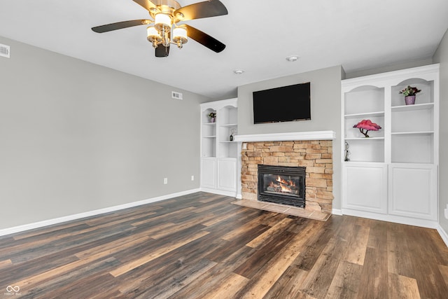 9754 Bradford Knoll Dr, Fishers, IN 46037 - unfurnished living room with dark wood finished floors, ceiling fan, a fireplace, and baseboards