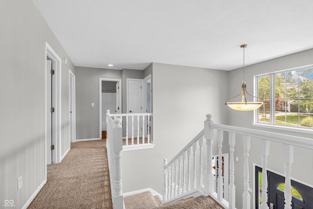 9754 Bradford Knoll Dr, Fishers, IN 46037 - hallway featuring an upstairs landing, carpet, and baseboards