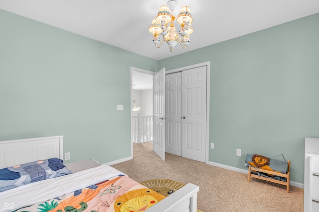 9754 Bradford Knoll Dr, Fishers, IN 46037 - bedroom featuring carpet floors, a chandelier, a closet, and baseboards