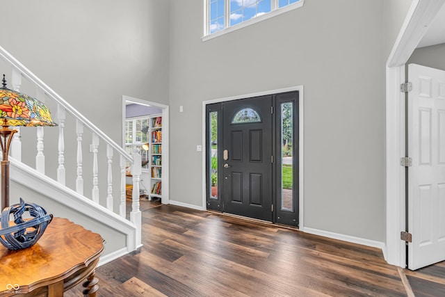 9754 Bradford Knoll Dr, Fishers, IN 46037 - entrance foyer with a towering ceiling, stairway, wood finished floors, and baseboards