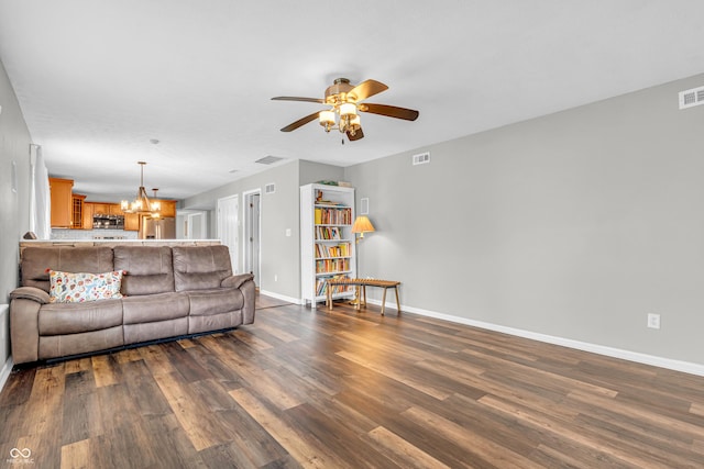 9754 Bradford Knoll Dr, Fishers, IN 46037 - living room featuring a chandelier, ceiling fan, dark wood finished floors, and baseboards
