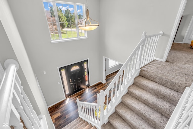 9754 Bradford Knoll Dr, Fishers, IN 46037 - foyer entrance featuring a high ceiling, baseboards, stairs, and wood finished floors