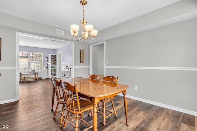 9754 Bradford Knoll Dr, Fishers, IN 46037 - dining space with a chandelier, baseboards, and dark wood finished floors