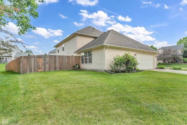 9754 Bradford Knoll Dr, Fishers, IN 46037 - view of side of property featuring driveway, a garage, and a shingled roof