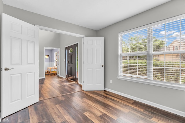 9754 Bradford Knoll Dr, Fishers, IN 46037 - unfurnished bedroom featuring baseboards and dark wood-type flooring