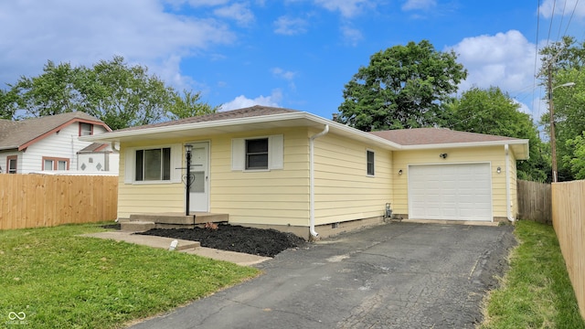 5806 E 19th St, Indianapolis, IN 46218 - view of front of property featuring an attached garage, driveway, and a shingled roof