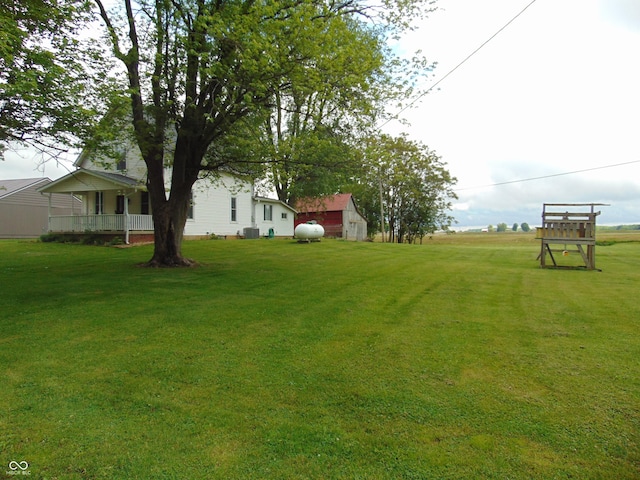 205 W S St, Darlington, IN 47940 - view of grassy yard with central air condition unit and an outdoor structure