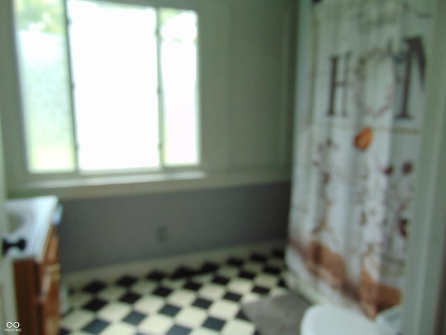 205 W S St, Darlington, IN 47940 - bathroom featuring vanity, toilet, and tile patterned floors