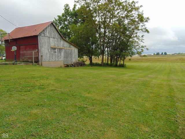 205 W S St, Darlington, IN 47940 - view of green lawn with an outdoor structure, a barn, and a garage