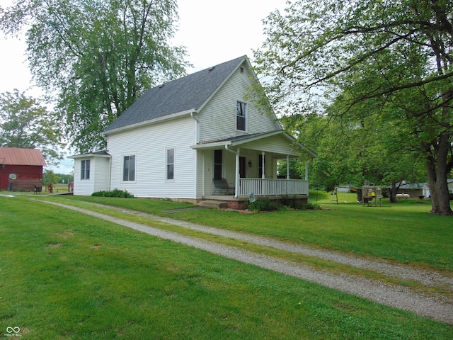 205 W S St, Darlington, IN 47940 - view of front facade featuring a porch, a front yard, and roof with shingles
