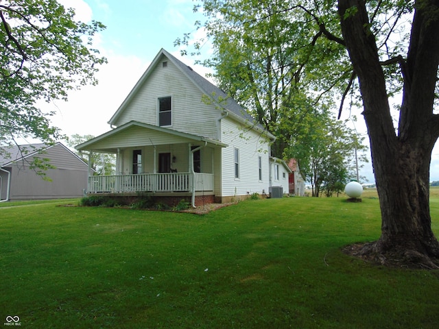 205 W S St, Darlington, IN 47940 - view of front of home with a porch, a front lawn, and central air condition unit