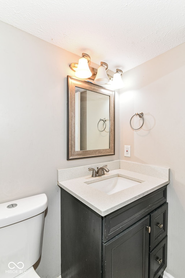 11612 E 75th St, Indianapolis, IN 46236 - bathroom featuring vanity, toilet, and a textured ceiling
