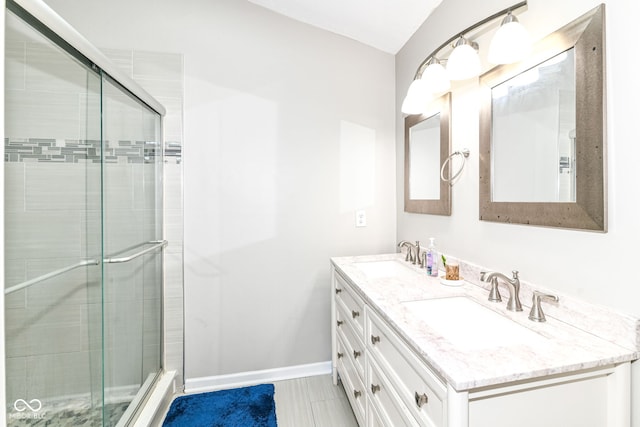 11612 E 75th St, Indianapolis, IN 46236 - bathroom featuring double vanity, a stall shower, baseboards, and tile patterned floors