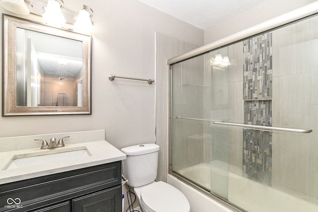 11612 E 75th St, Indianapolis, IN 46236 - full bath with toilet, vanity, bath / shower combo with glass door, and a textured ceiling