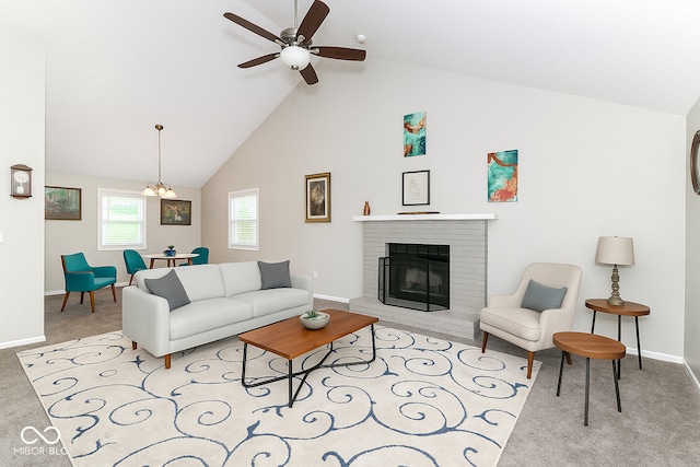 11612 E 75th St, Indianapolis, IN 46236 - carpeted living room with baseboards, a fireplace, a ceiling fan, high vaulted ceiling, and a chandelier
