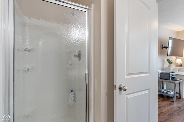9090 Demarest Dr, Fishers, IN 46038 - bathroom with a stall shower and wood finished floors