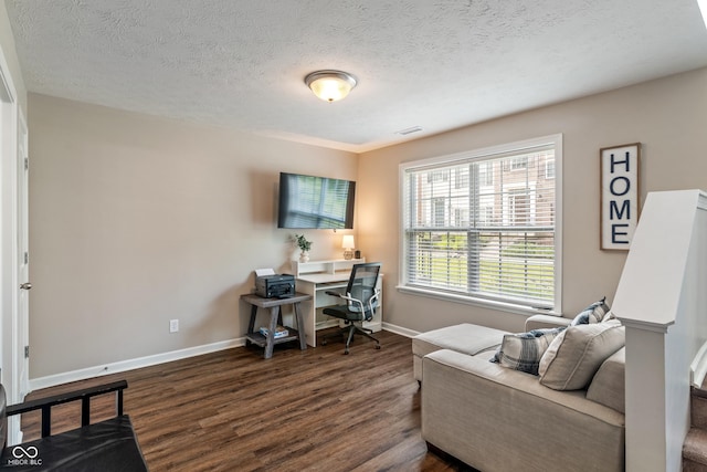 9090 Demarest Dr, Fishers, IN 46038 - office area featuring dark wood-style flooring, baseboards, and a textured ceiling
