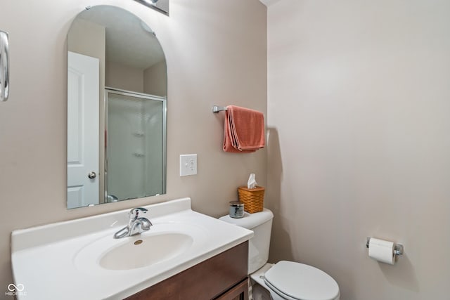 9090 Demarest Dr, Fishers, IN 46038 - bathroom featuring toilet, vanity, and a shower with door