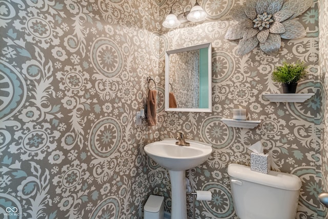 9090 Demarest Dr, Fishers, IN 46038 - half bathroom with wallpapered walls and toilet