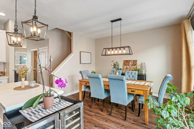 9090 Demarest Dr, Fishers, IN 46038 - dining area with a chandelier, wood finished floors, and baseboards