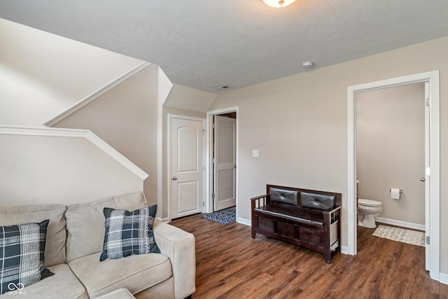 9090 Demarest Dr, Fishers, IN 46038 - living area featuring wood finished floors, baseboards, and a textured ceiling