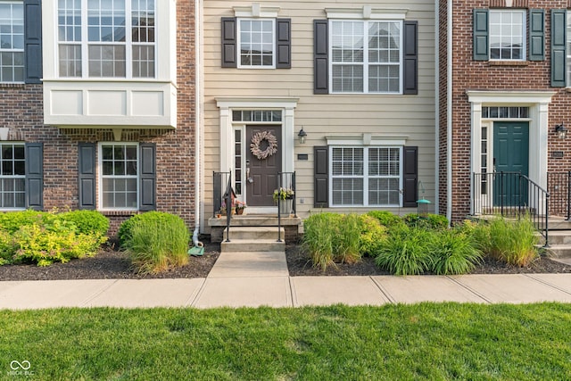 9090 Demarest Dr, Fishers, IN 46038 - property entrance featuring brick siding