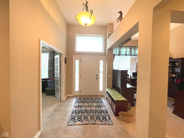 5010 Cabrillo Dr, Plainfield, IN 46168 - entrance foyer featuring tile patterned flooring and a towering ceiling