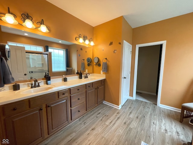 5010 Cabrillo Dr, Plainfield, IN 46168 - full bath featuring wood finished floors, double vanity, baseboards, and an enclosed shower