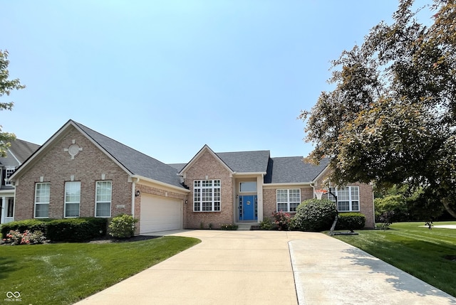 5010 Cabrillo Dr, Plainfield, IN 46168 - view of front of home with brick siding, concrete driveway, an attached garage, a front yard, and roof with shingles